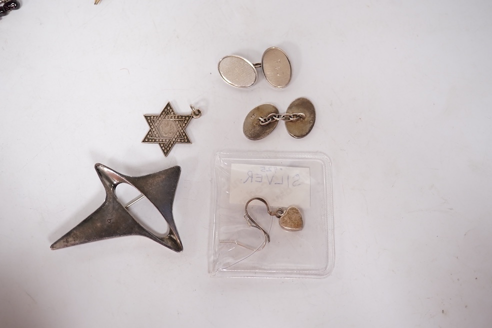 An early 1960's Georg Jensen sterling brooch, no. 339 (designed by Henning Koppel, 58mm, together with a small group of jewellery and other items including a pair of silver oval cufflinks, a Persian coin necklace, a 14ct